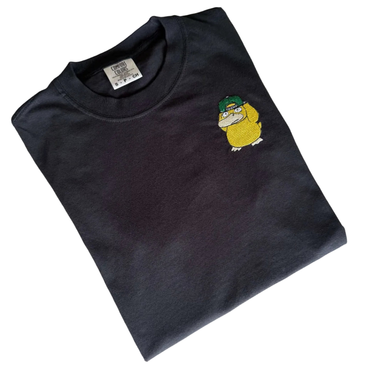 Cool Psyduck embroidered t-shirt with green snapback on dark Comfort Colors tee
